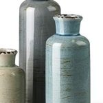 “CwlwGO ceramic vase 3-piece set on a wooden table with flower arrangements in a cozy living room.”