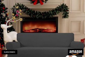 Dark gray stretchy sofa slipcover covering a three-seater couch