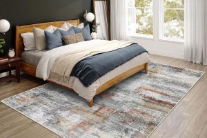 Gray and rust colored vivorug ultra soft area rug 5x7 displayed in a cozy modern living room