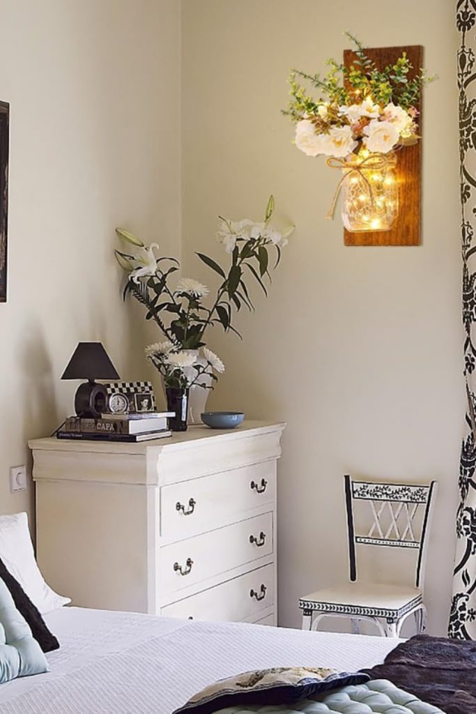 Set of two rustic mason jar wall sconces with LED fairy lights and white peony flowers
