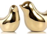 Gold bird figurine decor by FANTESTICRYAN on a modern shelf – elegant home accent piece