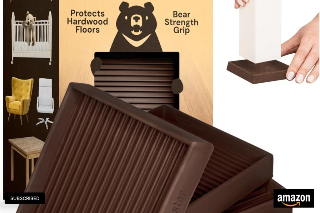 Set of 4 brown rubber square caster cups by CasterMaster placed under furniture legs on a hardwood floor.