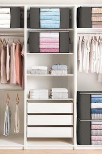 Set of six gray 90L large storage bags with reinforced handles stacked neatly