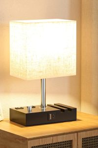 Set of 2 Kakanuo bedside lamps with beige shades, wooden base, USB-C ports, charging outlets, phone stands, and LED bulbs – ideal for bedroom or living room use