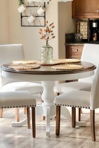 Set of 4 beige upholstered Parsons dining chairs with nailhead trim and wooden legs – perfect for kitchen or dining room seating