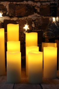 Set of 9 ivory flameless LED candles with remote timer, real wax battery-operated pillar candles in varying heights for fireplace, home, wedding, or festival décor