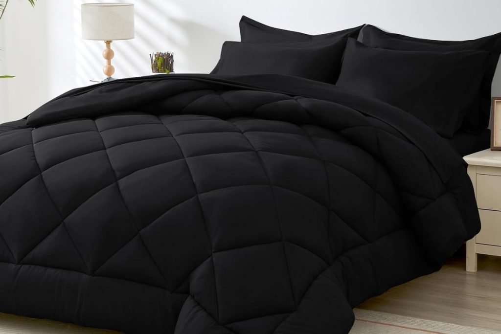 HEVUMYI 7-piece black queen comforter set with sheets and pillows on modern bed