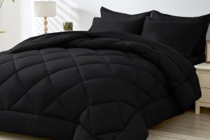 HEVUMYI 7-piece black queen comforter set with sheets and pillows on modern bed