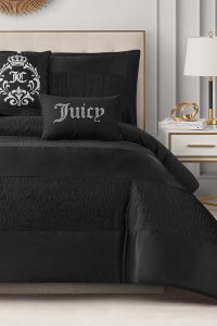 Juicy Couture Glam Night 5-piece comforter set in black stripe pattern on Queen/Full size bed, includes comforter, shams, and decorative pillows.