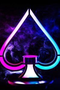 "LED illuminated liquor bottle display shelf with Ace of Spades champagne presenter and sparklers for nightclub VIP bottle service"