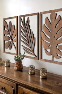 Set of 3 large modern wooden wall sculptures in a walnut finish featuring tree leaf designs, made from MDF oak, unframed for living room or office wall decor.