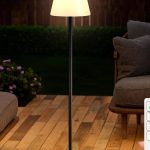 Black 59" solar-powered outdoor floor lamp with RGB and warm white dimmable LED lights, USB rechargeable, cordless round base.