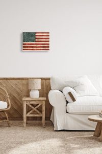 "Rustic American flag wall plaque with wood texture print, 10x15 inches, designed by Luke Wilson for Stupell Industries"