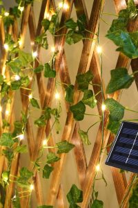 33ft Suddus solar ivy string lights with 100 warm white LEDs, waterproof design, 8 lighting modes, for balcony, patio, fence, or garden.