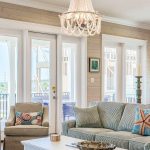 Wood beaded 3-light boho chandelier with white beads and black metal chain, ideal for farmhouse bedroom, dining room, or foyer lighting
