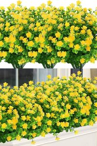 “UV-resistant yellow artificial flower bundles in outdoor garden setting”
