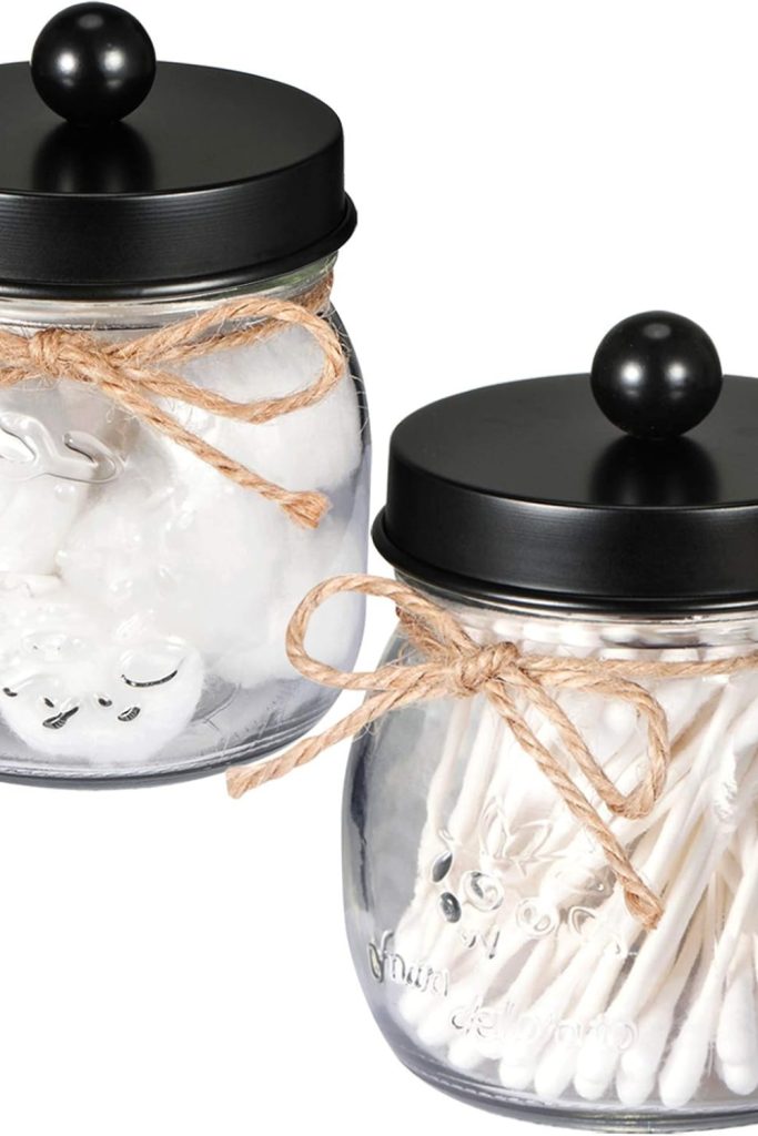 "SheeChung black Qtip holder jar with clear lid on bathroom counter"