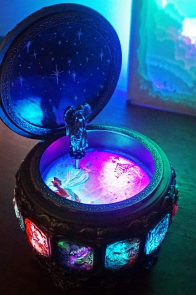 "Vintage constellation goddess music box with rotating figurine and LED lights"