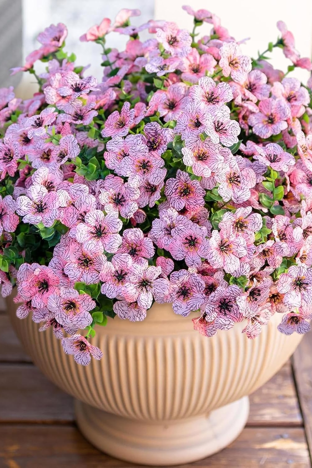 "12 bundles of colorful faux daisy flowers with eucalyptus leaves and boxwood greenery for outdoor and indoor decoration"