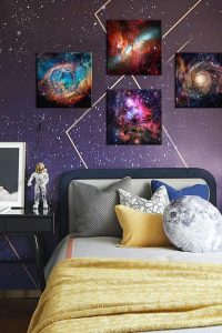 Galaxy canvas wall art set displayed in a boy’s bedroom