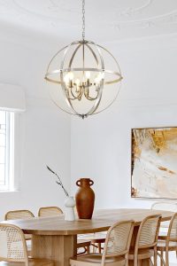 DLLT 6-light chrome globe pendant lighting fixture hanging over a modern kitchen island