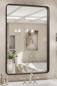 LOAAO 20x28 inch matte black metal framed bathroom mirror, anti-rust design, mounted horizontally over vanity in farmhouse-style bathroom