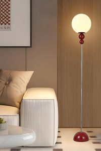 Red modern floor lamp with frosted globe shade and slim metal frame