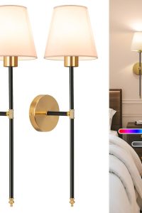 "NIORSUN black and gold battery operated wall sconce set mounted in bedroom"