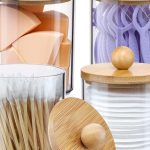 Full set of 4 jars on a vanity tray Alt text: "4-pack qtip holder set with bamboo lids displayed on a bathroom vanity"