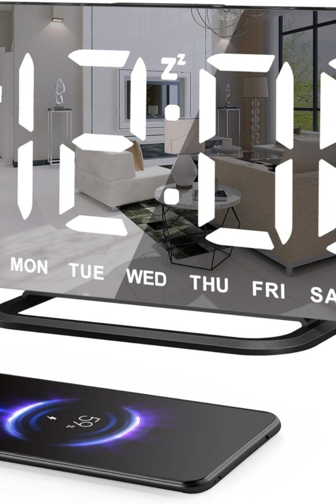 Slim LED Digital Alarm Clock with mirror surface, dimmable display, USB charging ports, and large time display – perfect for modern bedrooms or desks.