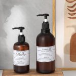 "Small wood pedestal tray on bathroom counter with soap and decor"