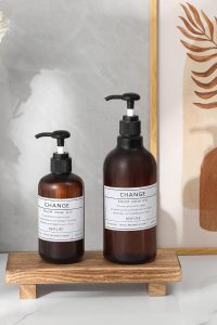 "Small wood pedestal tray on bathroom counter with soap and decor"