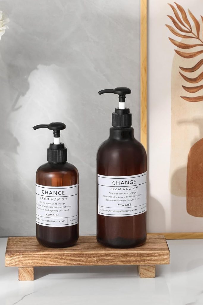 "Small wood pedestal tray on bathroom counter with soap and decor"