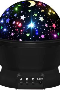 Star projector night light displaying galaxy pattern in kids’ bedroom