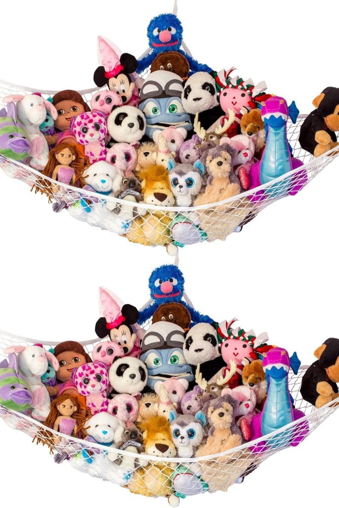 “Lilly’s Love stuffed animal hammock in nursery corner with plushies organized”