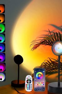"Sunset lamp projector LED light casting rainbow RGB colors on bedroom wall – 360 degree rotating night light for aesthetic room decor"