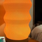 Wave Table Lamp with modern sculptural design, soft LED lighting, and sleek black finish – ideal for nightstands, desks, and home decor upgrades.
