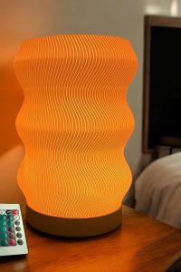 Wave Table Lamp with modern sculptural design, soft LED lighting, and sleek black finish – ideal for nightstands, desks, and home decor upgrades.