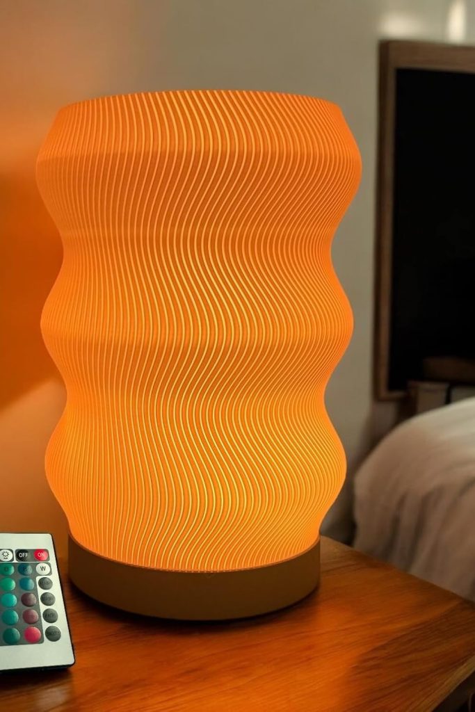 Wave Table Lamp with modern sculptural design, soft LED lighting, and sleek black finish – ideal for nightstands, desks, and home decor upgrades.