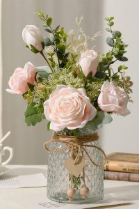 Pink silk rose bouquet in decorative vase for farmhouse table decor