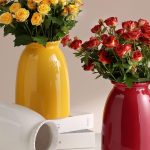 "Modern white ceramic flower vase by hjn, perfect for home decor accents on living room shelves, mantels, entryways, or bookshelves."