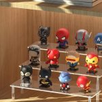 Aredpoook acrylic 3-tier display risers holding assorted perfumes on a vanity