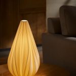RONDURE 12.5" modern table lamp with white ceramic shade on a wooden nightstand