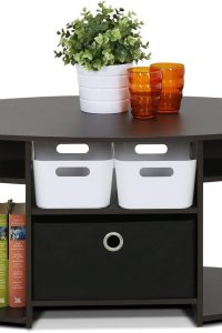 “Furinno Jaya Oval Coffee Table in Walnut finish with fabric storage bin in a modern living room”