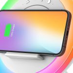 Bluetooth speaker with LED lights and wireless charging pad on a teen girl’s nightstand