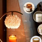 "Gold candle warmer lamp with crystal shade and wooden base"