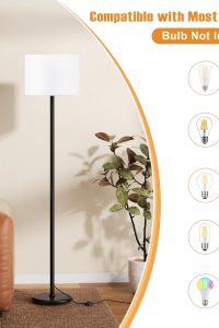 "Modern 60-inch black floor lamp with white fabric shade in living room"