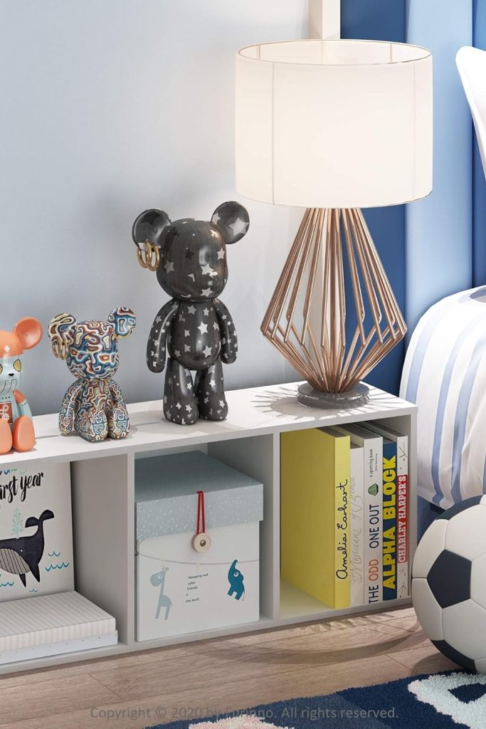 Furinno Luder 3-tier white bookcase holding books and dรฉcor in a living room