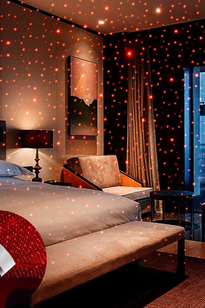 USB Star Projector Night Light with flexible gooseneck, projecting red LED stars in car interior