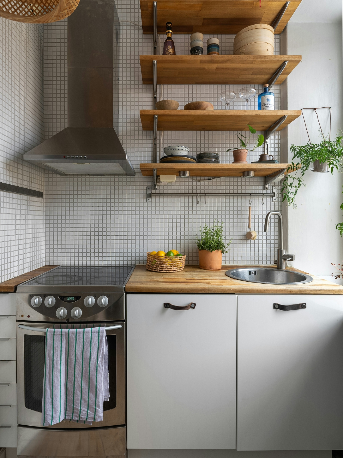 Small kitchen with smart appliances and modern storage solutions